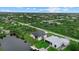 A stunning home situated on the water, surrounded by lush greenery and neighborhood homes at 14166 Fort Worth Cir, Port Charlotte, FL 33981