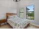 Bright bedroom with neutral walls, hardwood floors, and two large windows at 14166 Fort Worth Cir, Port Charlotte, FL 33981