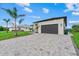Beautiful new construction home with a wide paved driveway and well-maintained landscaping at 14166 Fort Worth Cir, Port Charlotte, FL 33981