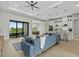 Open concept living room and kitchen featuring modern decor, bright lighting and outside patio access at 14166 Fort Worth Cir, Port Charlotte, FL 33981
