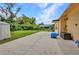 Backyard featuring a concrete patio and green lawn with a storage shed at 1478 Harmony Dr, Port Charlotte, FL 33952