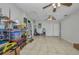 Open bonus room featuring tile floors, natural light, and access to other areas at 1478 Harmony Dr, Port Charlotte, FL 33952