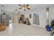 Spacious bonus room with tile flooring, ceiling fans, and sliding doors to the outdoors at 1478 Harmony Dr, Port Charlotte, FL 33952