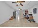 Expansive bonus room with tile flooring, ceiling fans, and natural light at 1478 Harmony Dr, Port Charlotte, FL 33952