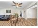 Open dining area with views of the adjacent living area, and featuring a ceiling fan at 1478 Harmony Dr, Port Charlotte, FL 33952