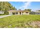 Charming single-story home featuring a well-maintained lawn and inviting curb appeal in a lovely neighborhood at 1478 Harmony Dr, Port Charlotte, FL 33952