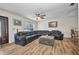 Inviting living room showcases a leather sofa, a unique coffee table, and bright, natural light at 1478 Harmony Dr, Port Charlotte, FL 33952
