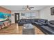 Cozy living room featuring leather furniture, stylish lighting, and a decorative coffee table at 1478 Harmony Dr, Port Charlotte, FL 33952