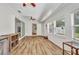 Bright living room features wood floors and large windows, creating a warm atmosphere at 1478 Harmony Dr, Port Charlotte, FL 33952