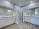 Bathroom with double vanities and a glass shower enclosure at 15741 Autry Cir, Port Charlotte, FL 33981