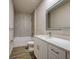 Modern bathroom featuring a vanity with a quartz countertop and stylishly tiled shower and tub combo at 15741 Autry Cir, Port Charlotte, FL 33981