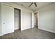 Well-lit bedroom featuring modern flooring and a convenient closet with sliding doors at 15741 Autry Cir, Port Charlotte, FL 33981
