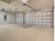 Spacious two car garage with epoxy flooring providing ample room for vehicles and storage at 15741 Autry Cir, Port Charlotte, FL 33981