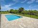 Backyard pool and fenced-in yard create a serene retreat at 15741 Autry Cir, Port Charlotte, FL 33981