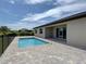Beautiful backyard pool and brick patio, perfect for outdoor enjoyment at 15741 Autry Cir, Port Charlotte, FL 33981