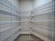 Spacious walk-in closet with wire shelving for optimal organization and storage space at 15741 Autry Cir, Port Charlotte, FL 33981