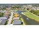 Charming single-story home with lush landscaping, nestled on a waterfront lot in a golf course community at 1617 Britannia Blvd, Punta Gorda, FL 33980