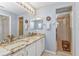 Bathroom featuring double sinks, granite countertops, and a large glass shower enclosure at 1617 Britannia Blvd, Punta Gorda, FL 33980