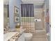 Bathroom featuring granite countertops, vanity, and a shower and tub combo at 1617 Britannia Blvd, Punta Gorda, FL 33980