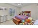 Bedroom with large windows and shutters that provide natural light and privacy at 1617 Britannia Blvd, Punta Gorda, FL 33980