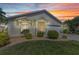 Charming single-story home with a well-maintained lawn and beautiful sunset sky at 1617 Britannia Blvd, Punta Gorda, FL 33980