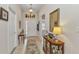 Inviting foyer with tiled floors, decorative display, and a view into other rooms at 1617 Britannia Blvd, Punta Gorda, FL 33980