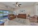 Open-plan living room featuring comfortable seating and a ceiling fan at 1617 Britannia Blvd, Punta Gorda, FL 33980