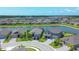 An aerial view reveals the home's appealing location near a lake, with well-kept landscaping and multiple parking spaces at 16833 Terrapin Key Dr, Port Charlotte, FL 33953