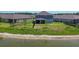 Aerial view of the home's backyard with a scenic pond view at 16833 Terrapin Key Dr, Port Charlotte, FL 33953