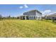 Large, well-maintained backyard with a view of the home's patio, providing a private oasis at 16833 Terrapin Key Dr, Port Charlotte, FL 33953