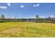 Lush backyard with views of the lake, perfect for outdoor activities and enjoying nature at 16833 Terrapin Key Dr, Port Charlotte, FL 33953
