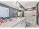 Bathroom features a double sink vanity, walk-in shower and nautical decorations at 16833 Terrapin Key Dr, Port Charlotte, FL 33953