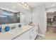 Modern bathroom features a walk-in shower, double sink vanity, and walk-in closet at 16833 Terrapin Key Dr, Port Charlotte, FL 33953