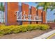 The West Port community sign is beautifully landscaped and offers a welcoming entrance at 16833 Terrapin Key Dr, Port Charlotte, FL 33953
