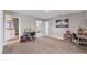 Spacious living room with carpet, a neutral color palette, and multiple entrances at 16833 Terrapin Key Dr, Port Charlotte, FL 33953