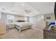 A spacious main bedroom featuring recessed lighting, tray ceilings, and plenty of natural light at 16833 Terrapin Key Dr, Port Charlotte, FL 33953