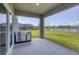 This covered patio features a built-in outdoor kitchen with grill and sink, perfect for entertaining at 16833 Terrapin Key Dr, Port Charlotte, FL 33953