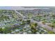 Areal view showcases homes along canals and waterfront properties with lush landscaping, community, and access to open water at 180 Palmetto Ne Cir, Port Charlotte, FL 33952