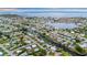 Scenic aerial view of homes along winding canals, offering waterfront living and convenient access to open water at 180 Palmetto Ne Cir, Port Charlotte, FL 33952
