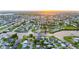 Aerial view of a waterfront community with canals, lush greenery, and beautiful homes at 180 Palmetto Ne Cir, Port Charlotte, FL 33952