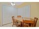 Dining Area with classic wood table and adjacent storage closet at 180 Palmetto Ne Cir, Port Charlotte, FL 33952