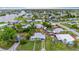 Cozy single-story home with well-maintained lawn, lush trees, and a tranquil backyard setting at 180 Palmetto Ne Cir, Port Charlotte, FL 33952