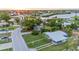 Lovely single-story home with mature trees, green lawn, and a convenient covered parking area at 180 Palmetto Ne Cir, Port Charlotte, FL 33952