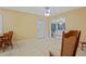 Open floor plan living room with tile flooring and ceiling fan at 180 Palmetto Ne Cir, Port Charlotte, FL 33952