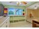Bright room with a window, shelving and view of the next room at 180 Palmetto Ne Cir, Port Charlotte, FL 33952