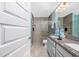 Bathroom featuring glass door shower, dual sink vanity with granite counters at 185 Hercules Dr, Rotonda West, FL 33947