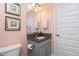 Bathroom contains vanity with granite countertop and decorative details at 185 Hercules Dr, Rotonda West, FL 33947