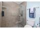 Bathroom boasts a glass shower with a decorative towel and toilet at 185 Hercules Dr, Rotonda West, FL 33947