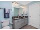 Bathroom featuring dual sink vanity with granite counters and tiled floor at 185 Hercules Dr, Rotonda West, FL 33947