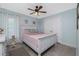 Bedroom provides natural light, tile flooring, ceiling fan and closet at 185 Hercules Dr, Rotonda West, FL 33947